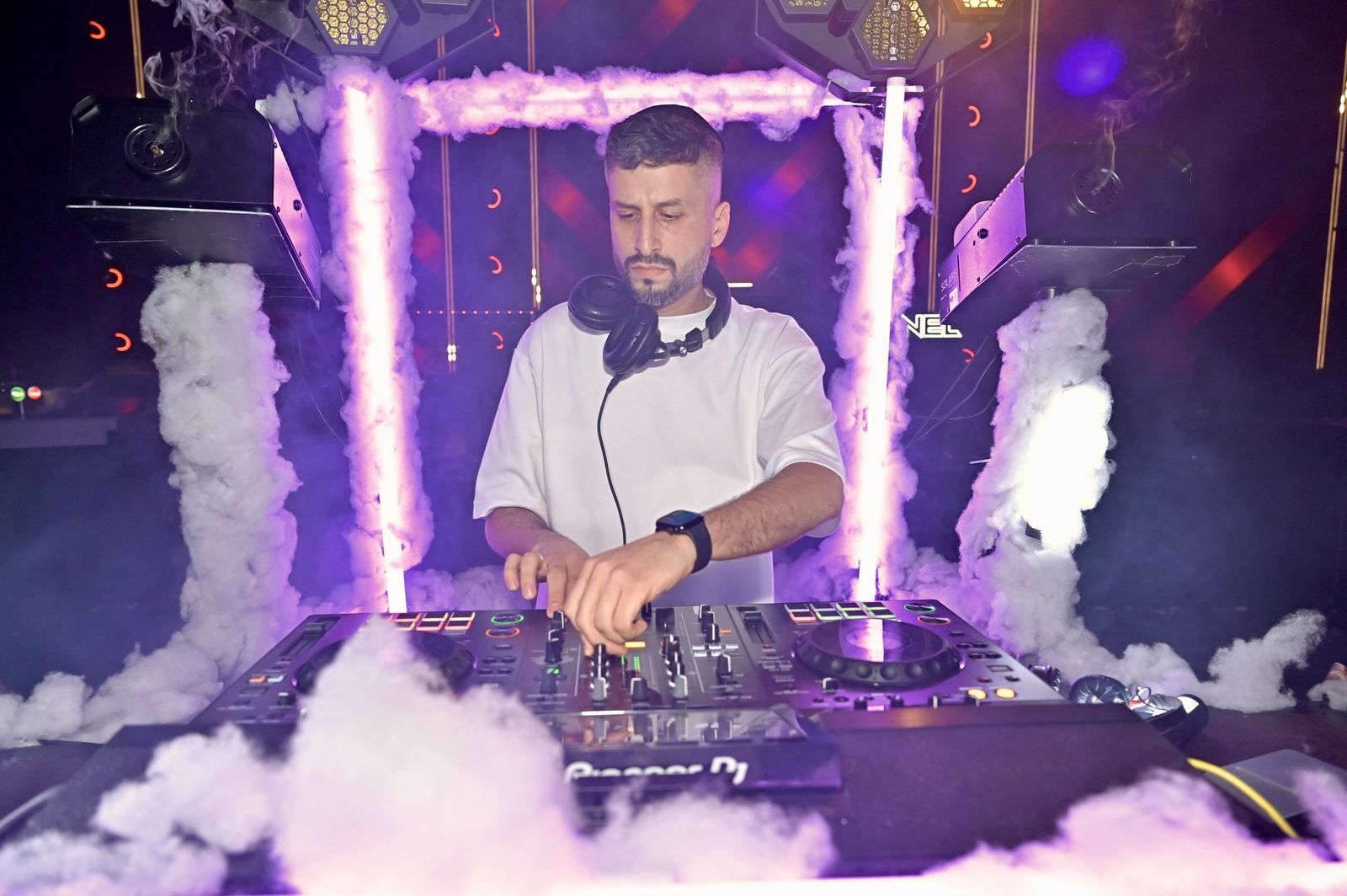 DJ Shlomi Shanti performing at the decks